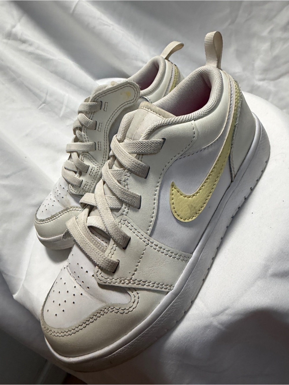 Nike Cream Sneakers with Pale Yellow Swoosh